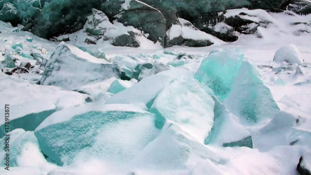 Glacier of beautiful unique turquoise color on background of snow in Arctic. Amazing ice desert landscape. Silence quiet of wilderness North Pole Way to Pyramid on Spitsbergen Svalbard in Norway. Glacier of beautiful unique turquoise color on background of snow in Arctic. Amazing ice desert landscape. Silence quiet of wilderness North Pole Way to Pyramid on Spitsbergen Svalbard in Norway.