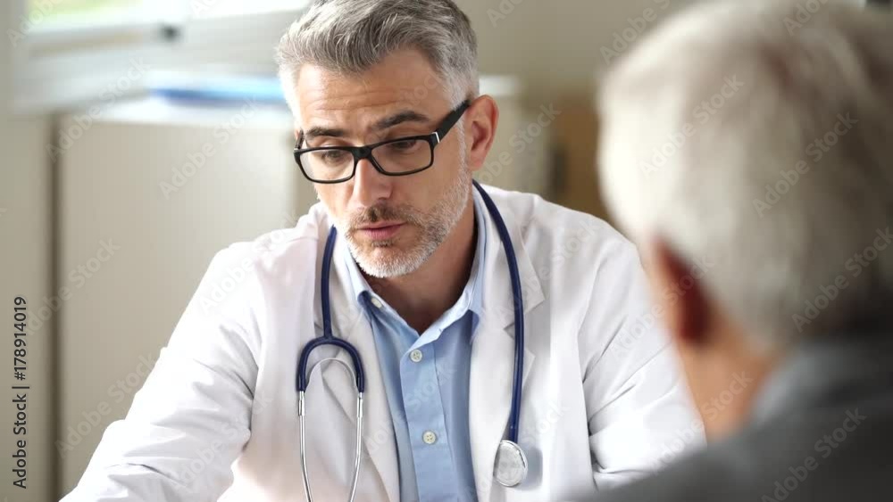 Doctor talking to patient in office