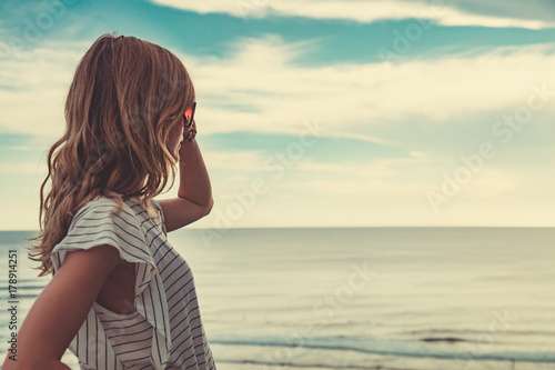 Girl enjoying the ocean tropical view scenery.