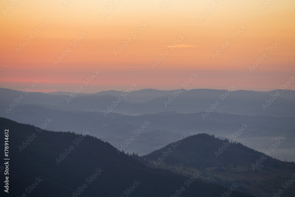 Sunrise against the background of the Carpathian mountains in the summer. Ukraine
