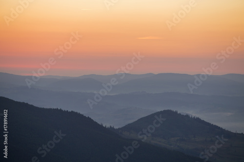 Sunrise against the background of the Carpathian mountains in the summer. Ukraine © OlegD