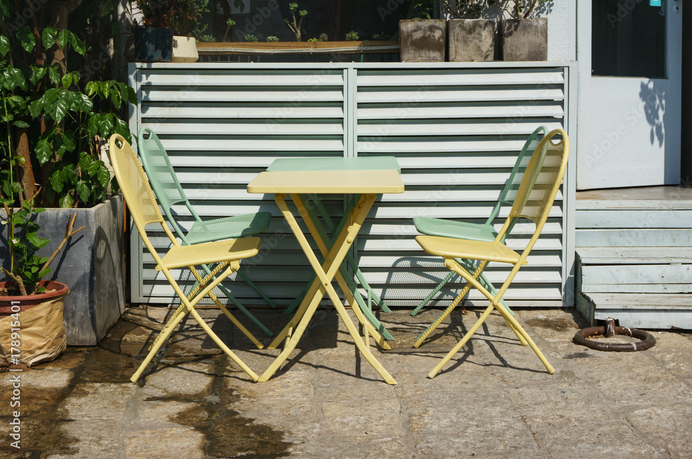 Outdoor desk and chairs at coffee shop