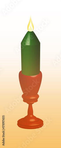 Burning green candle in a red candlestick