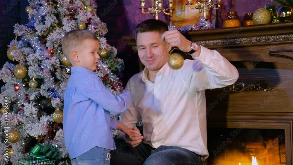 Father and son play Christmas tree balls. HD. Father and son play Christmas tree balls. HD.