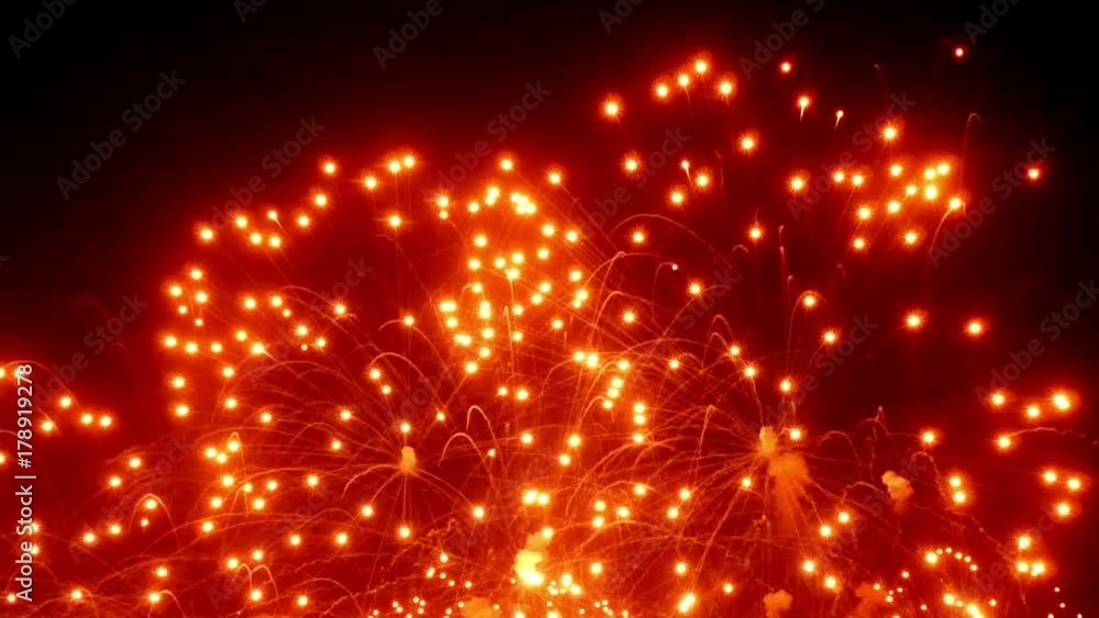 Firework display at night on black background. Bright red green yellow explosions. Amazingly beautiful. Salute for new year Christmas and other holidays. Macro video closeup footage 30p. Firework display at night on black background. Bright red green yellow explosions. Amazingly beautiful. Salute for new year Christmas and other holidays. Macro video closeup footage 30p.