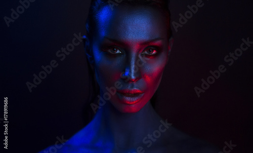 Art Portrait of Beautiful Sexy Young Woman with glamorous mystical makeup