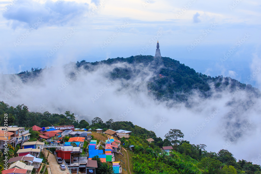 Amazing view of Pagoda on top of mountain with the mist and color full villa at Phu Tub Berk, Thailand