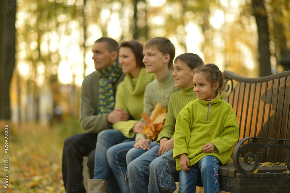 family in autumn forest