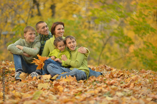 family in autumn forest