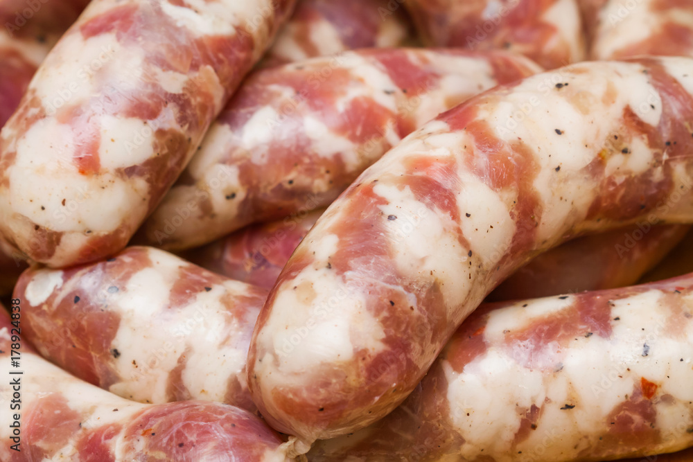 Raw handmade sausages. Selective focus, closeup. Raw handmade sausages. Selective focus, closeup.