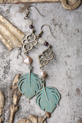Beautiful earrings and vintage background
