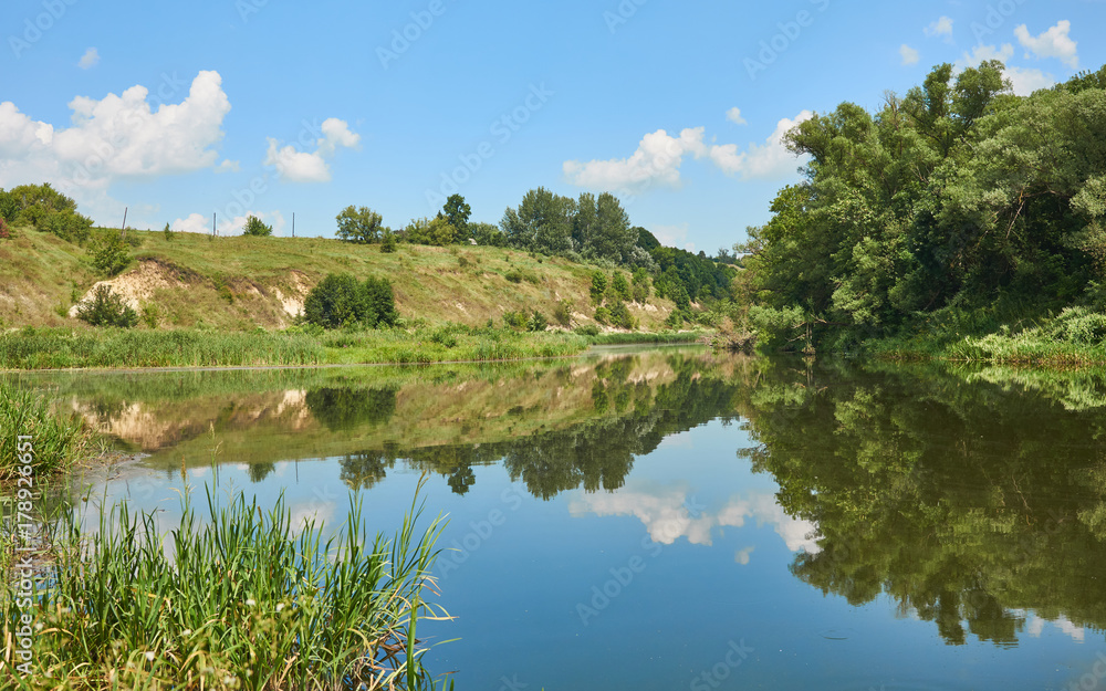 Fototapeta premium River with reflection of the sky