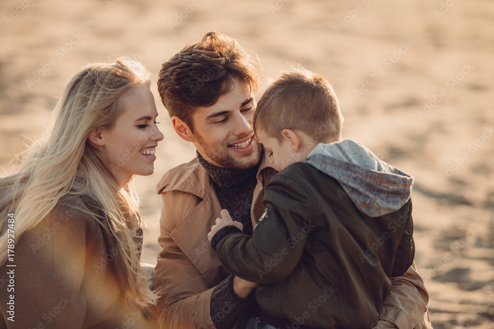 Fototapeta premium family spending time on beach