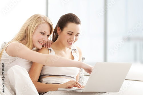 Young Women Surfing the Internet with Laptop