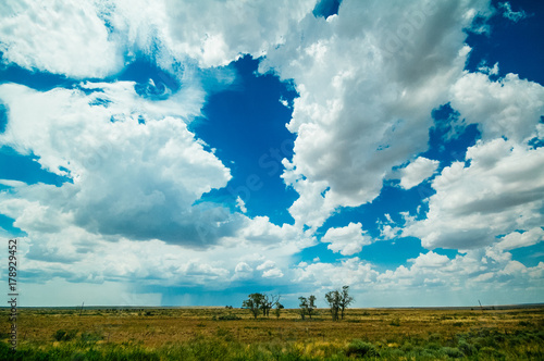 Εκτύπωση καμβά The plains of northern Texas under a blue sky, with a storm in the distance