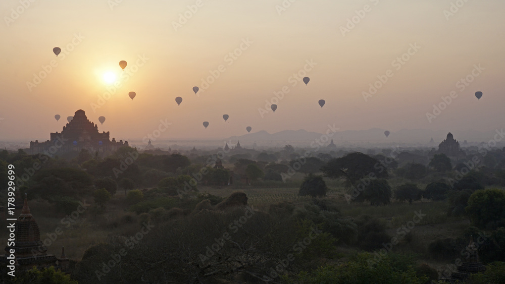 Sunrise as dozens of hot air balloons take off over Bagan, Myanmar.
