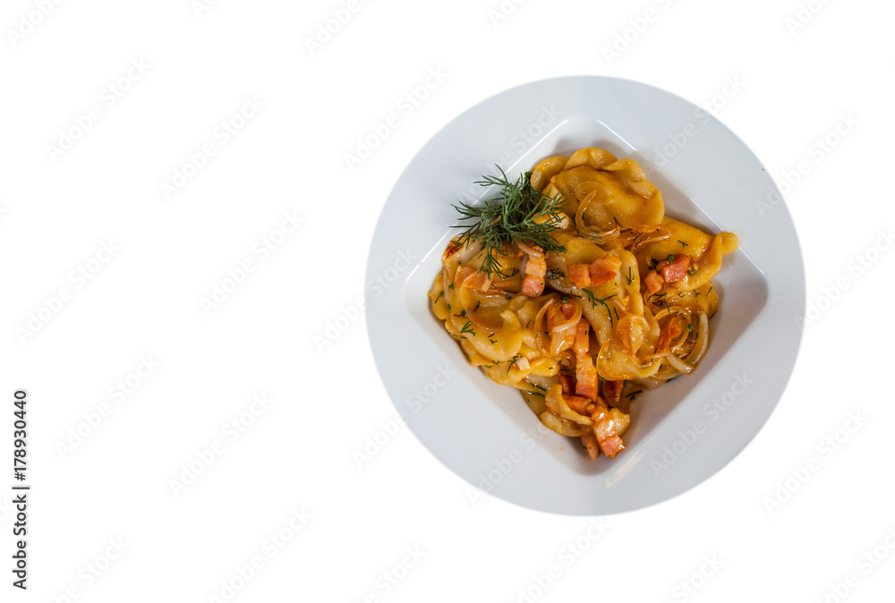 Dumplings with potatoes and bacon in a bowl. with copy space. top view. isolated on white
