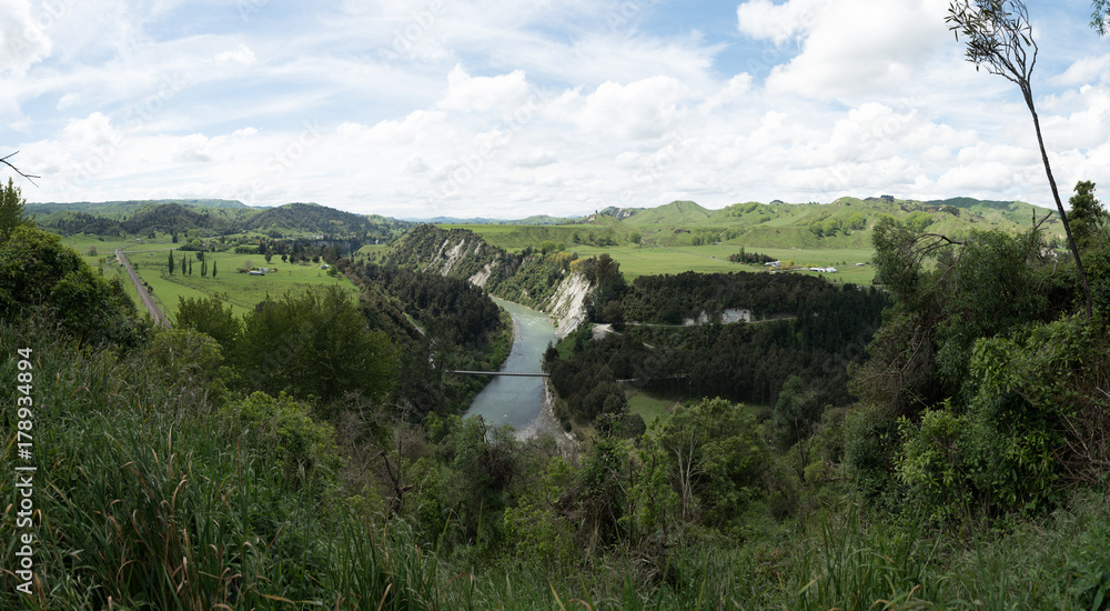 Manawatu river flowing through a wooded landscape in New Zealand