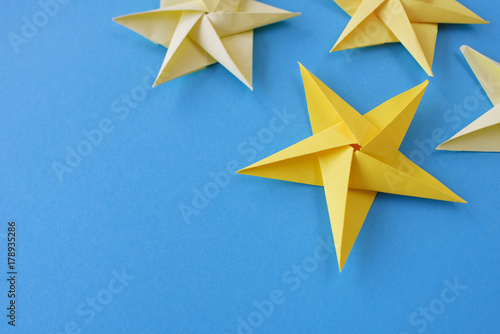 Lesson of origami. A Christmas star from paper