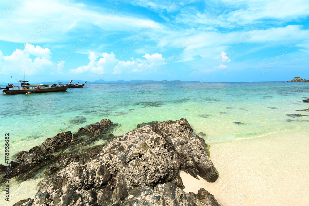 Kai island, Phuket, Thailand. Small tropical island with white sandy beach and blue transparent water of Andaman sea.