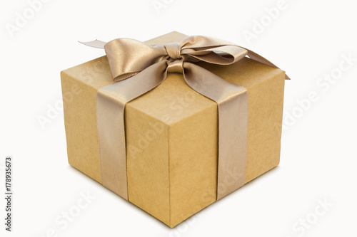 Cardboard gift box with golden ribbon, clipping path