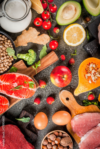 Wallpaper Mural Healthy diet background. Organic food ingredients, superfoods: beef and pork meat, chicken filet, salmon fish, beans, nuts, milk, eggs, fruits, vegetables. Black stone table, copy space top view Torontodigital.ca