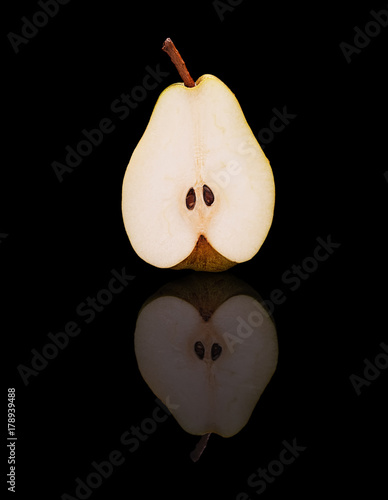 One pear cut in half