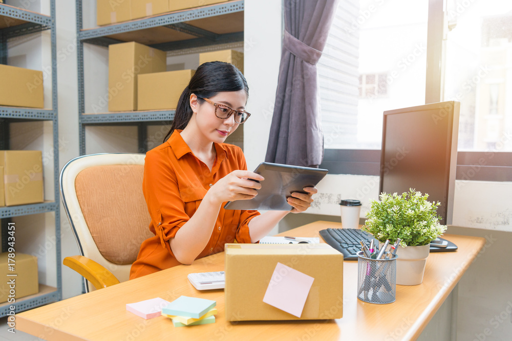 woman office worker using mobile digital tablet woman office worker using mobile digital tablet