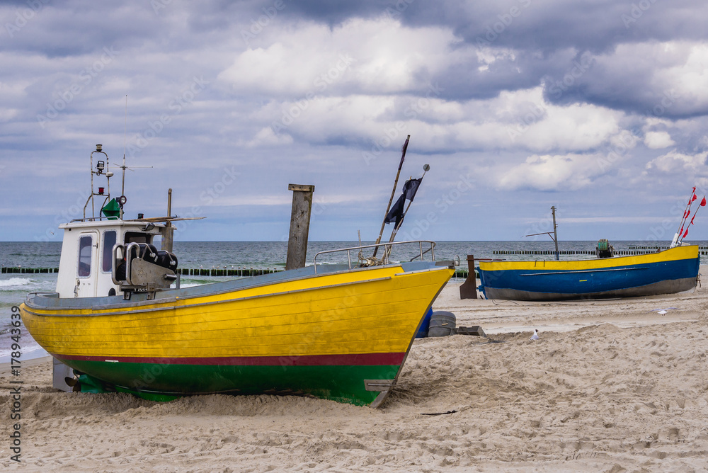 Fishing boats on a beach in Rewal, Poland Fishing boats on a beach in Rewal, Poland
