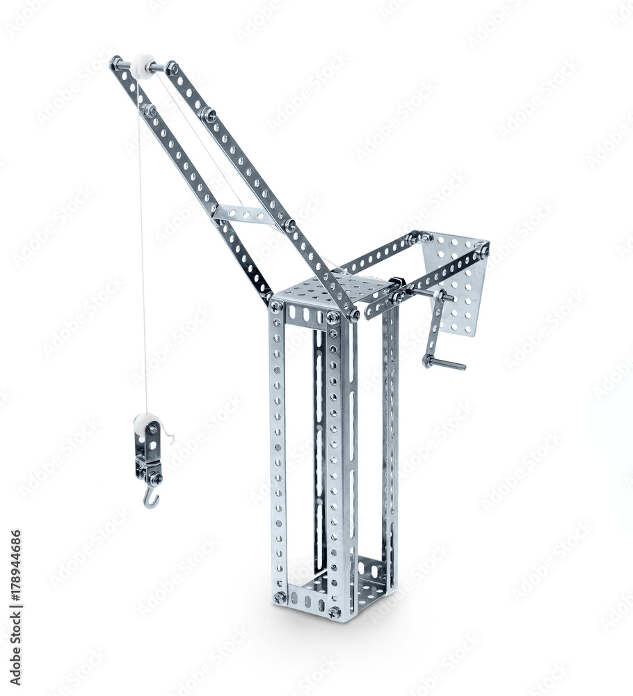 metal toy hoisting crane isolated on white