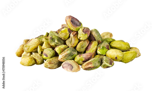 a heap of pistachio nuts isolated on white