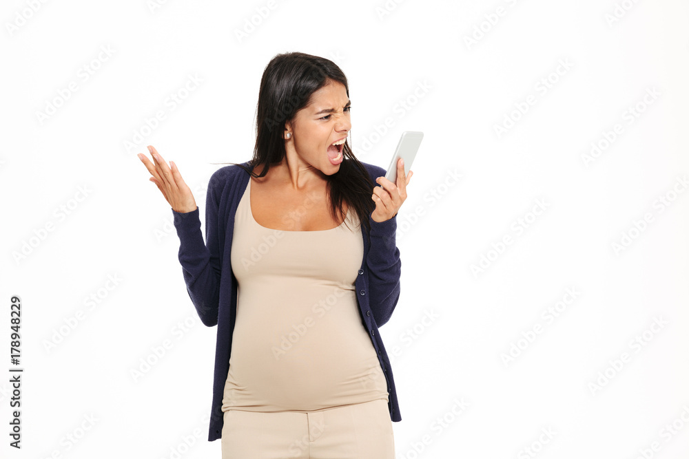 Portrait of an angry irritated pregnant woman yelling Portrait of an angry irritated pregnant woman yelling