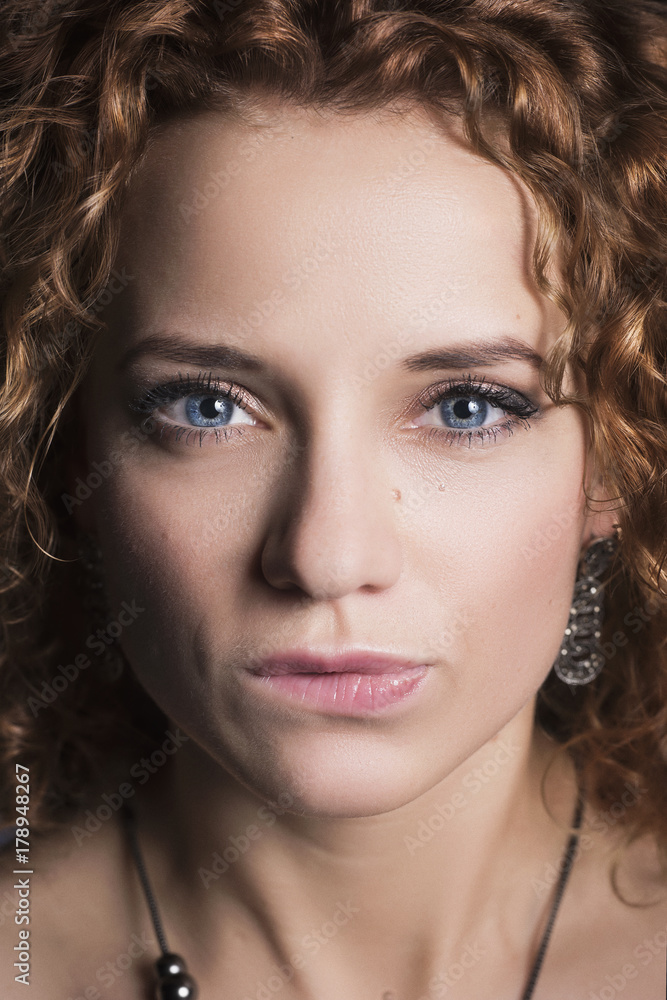 Portrait of a beautiful girl with curly hair close-up Portrait of a beautiful girl with curly hair close-up