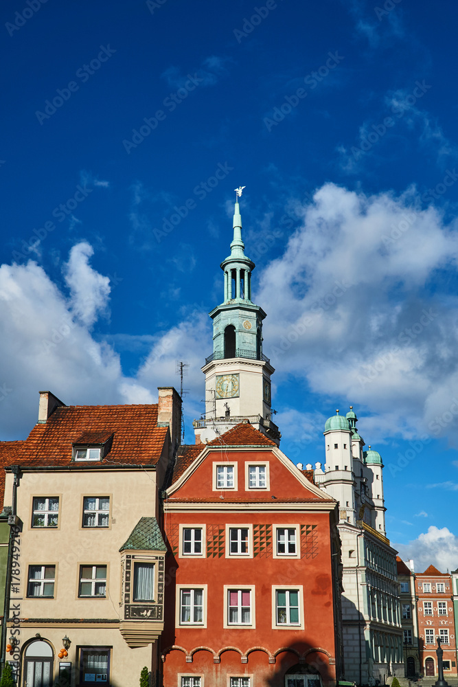 Old market with  townhouses and Renaissance town hall tower in Poznan.