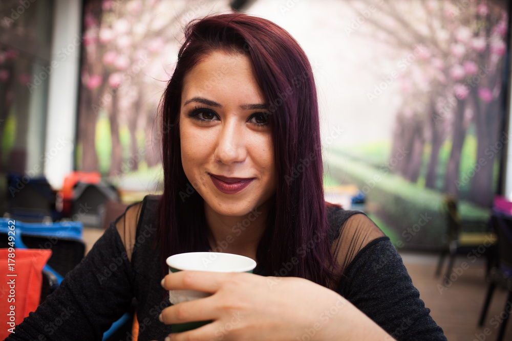 Beautiful girl drinking coffee at the coffee shop Beautiful girl drinking coffee at the coffee shop