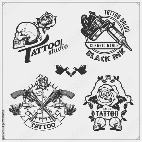 Vector set of tattoo salon labels, badges and design elements. Tattoo studio emblems with professional equipment, rose, gun and skull.