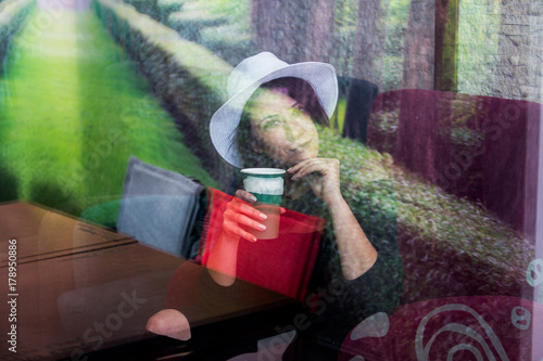 Beautiful girl drinking coffee at the coffee shop