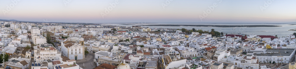 Sunset aerial cityscape in Olhao, Algarve fishing village view of ancient neighbourhood of Levante, and its traditional cubist architecture.