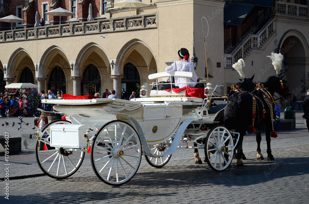 Cab on the main square - old town in Krakow, Poland