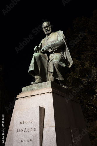Statue of Alois Jirasek, Prague, Czech Republic / Czechia - sculpture of famous czech writer, author, prosaic and novelist. Monument is lit by light during night photo