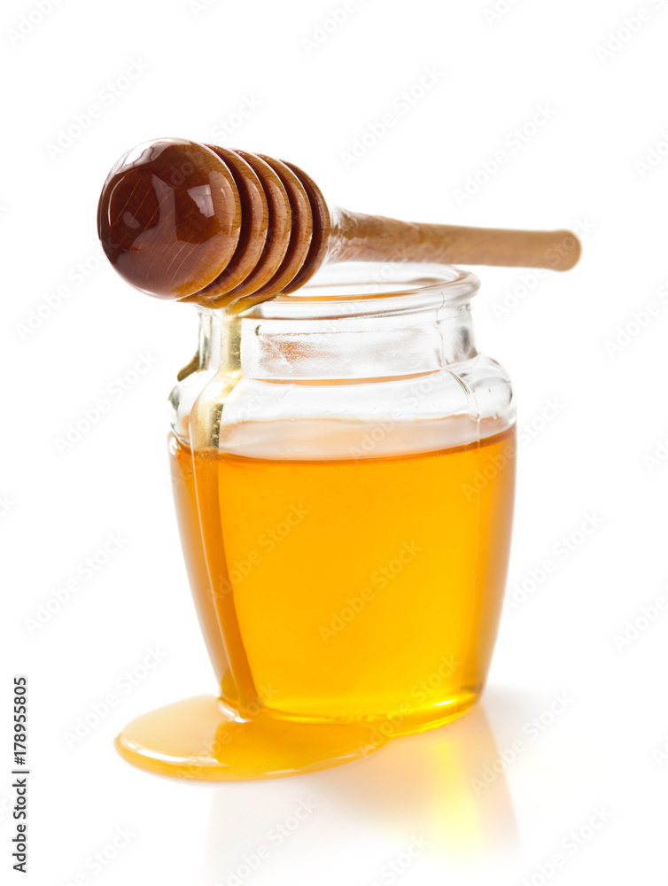 jar of honey on white background jar of honey on white background