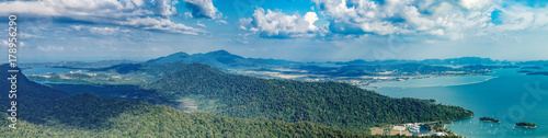 Panoramic view of blue sky  sea and mountain seen from Cable Car viewpoint  Langkawi  Malaysia. Picturesque landscape with tropical forest  beaches  small Islands in waters of Strait of Malacca