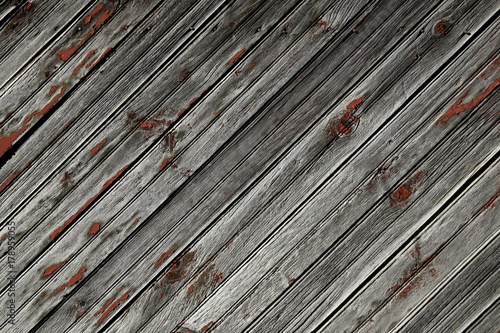  weathered wooden background with specks of red peeled off paint, diagonal lines 