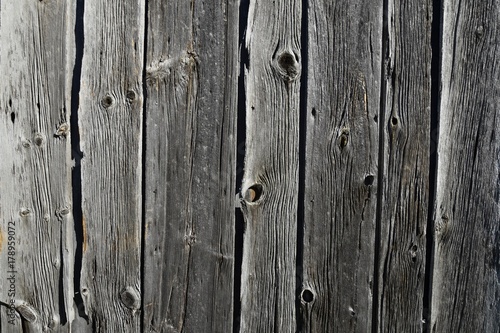 closeup of an old weathered wooden slat wall for backgrounds