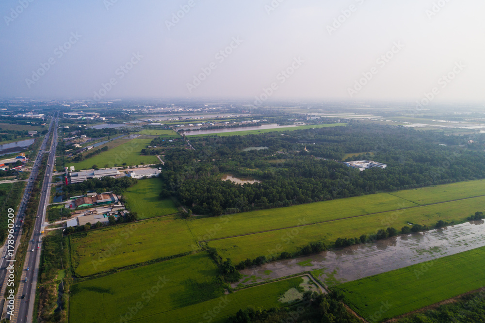 Aerial vew of rural road with car and gree tree into th west region of Thailand