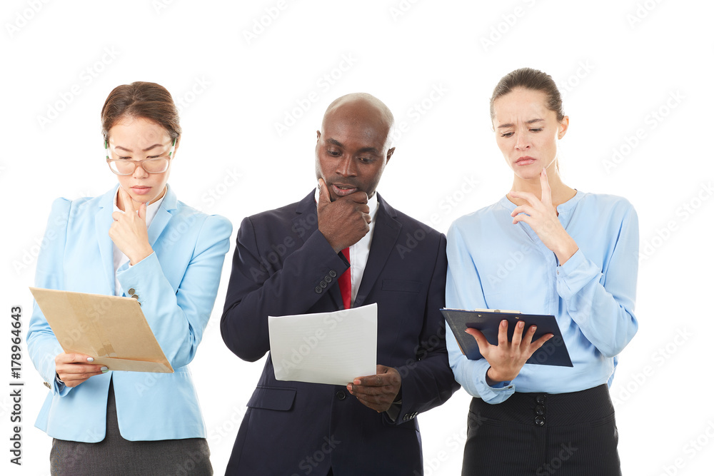 Portrait of confident multi-ethnic business team of three on white background Portrait of confident multi-ethnic business team of three on white background