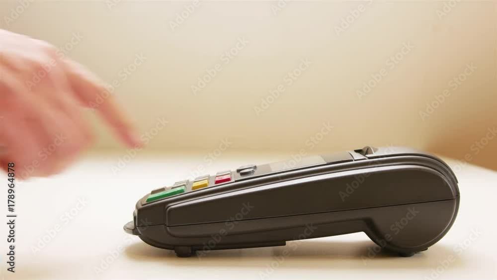 Credit card swipe through terminal machine and entering the pin code On white table, 4k video Credit card swipe through terminal machine and entering the pin code On white table, 4k video
