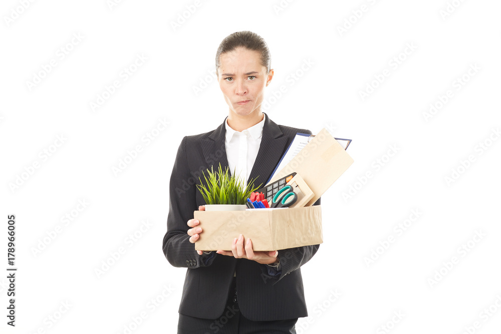 Portrait of female employee holding box with belongings Portrait of female employee holding box with belongings