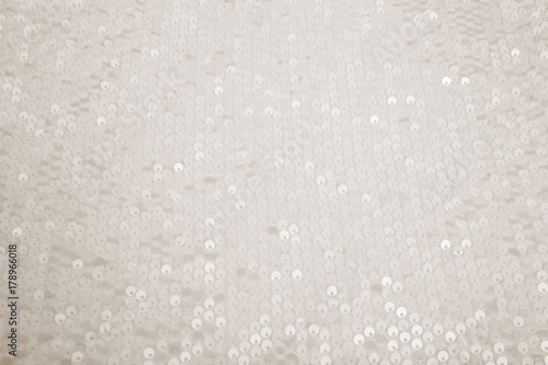 rectangular shiny white fabric with sequins, festive background