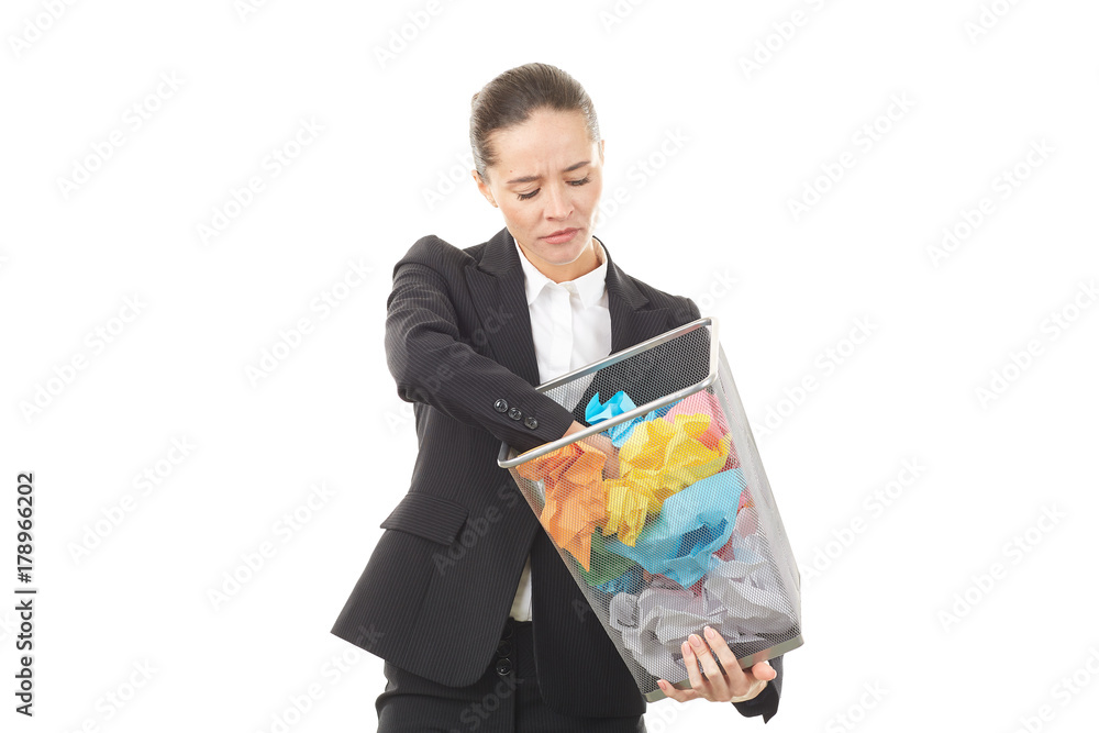 Portrait of female office worker holding basket with crumpled papers Portrait of female office worker holding basket with crumpled papers